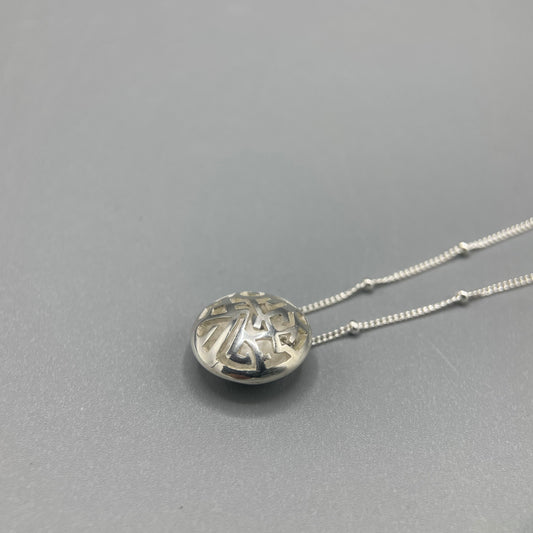 Kathryn Arbon Small hand pierced domed pendant