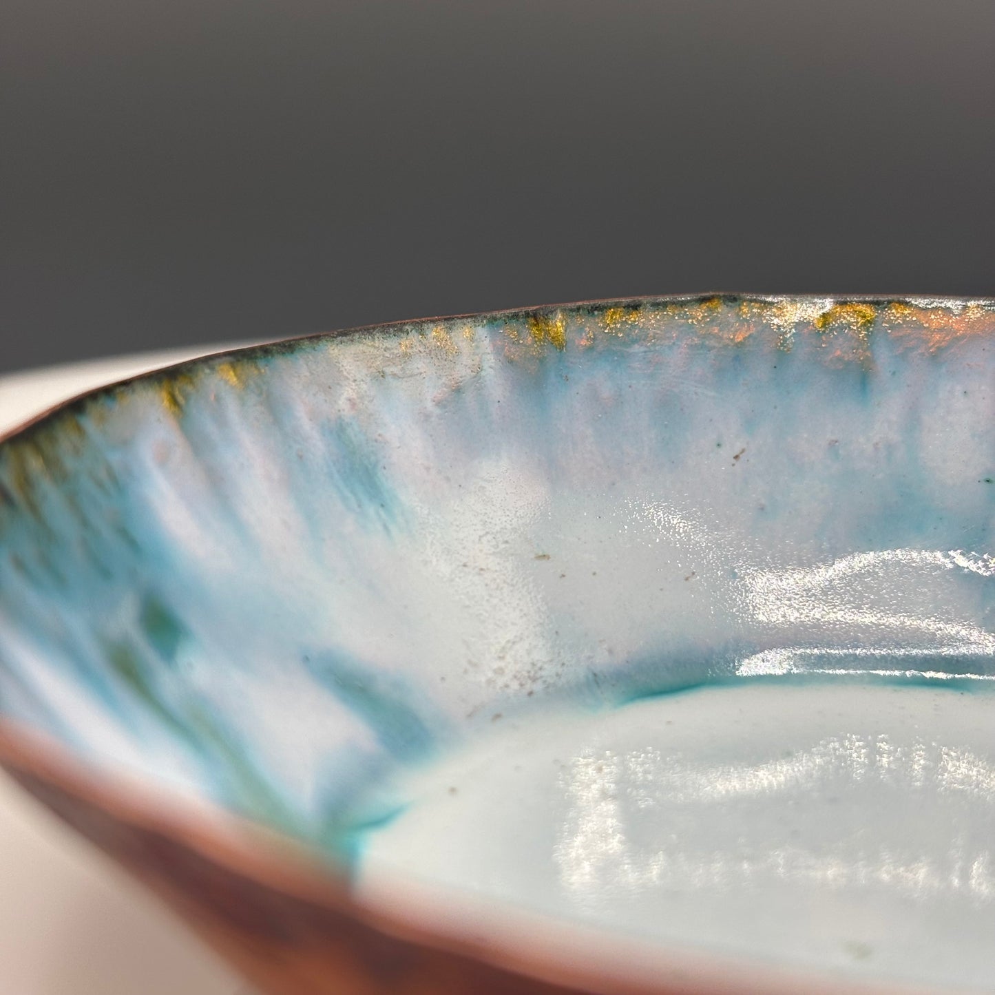 Cruan Marino Small Enamelled Copper Bowl Soft White II, close-up of interior showing teal and white enamel with gold rim detail