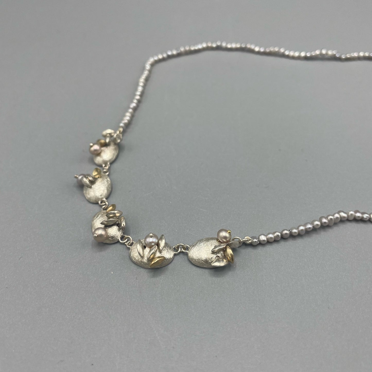 Susi Hines Articulated silver and gold seeds necklace with seed pearls