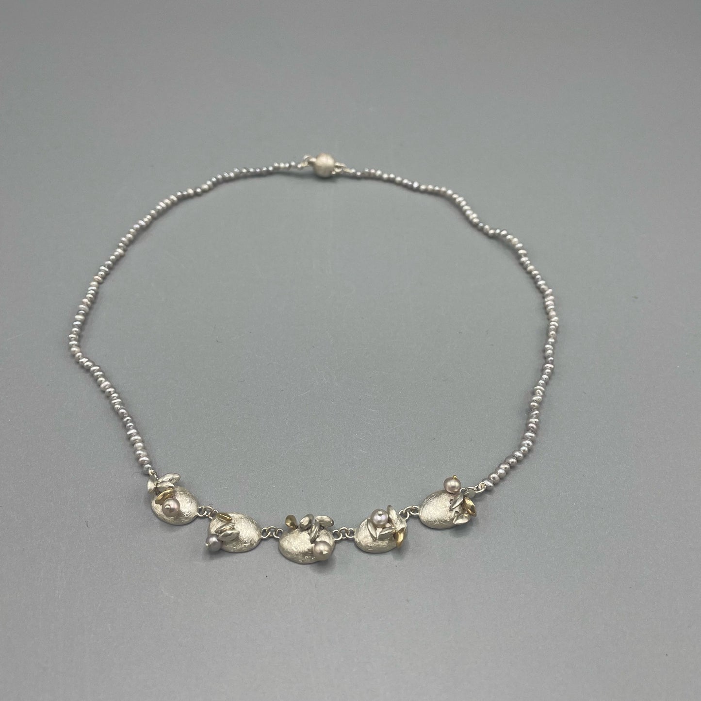 Susi Hines Articulated silver and gold seeds necklace with seed pearls